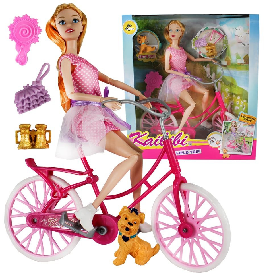 Muñeca con bicicleta y accesorios